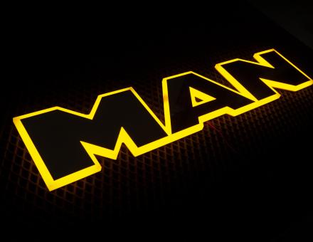 Надпись на решетку Man нержавейка с оранжевой подсветкой (63см.*13,5см.)